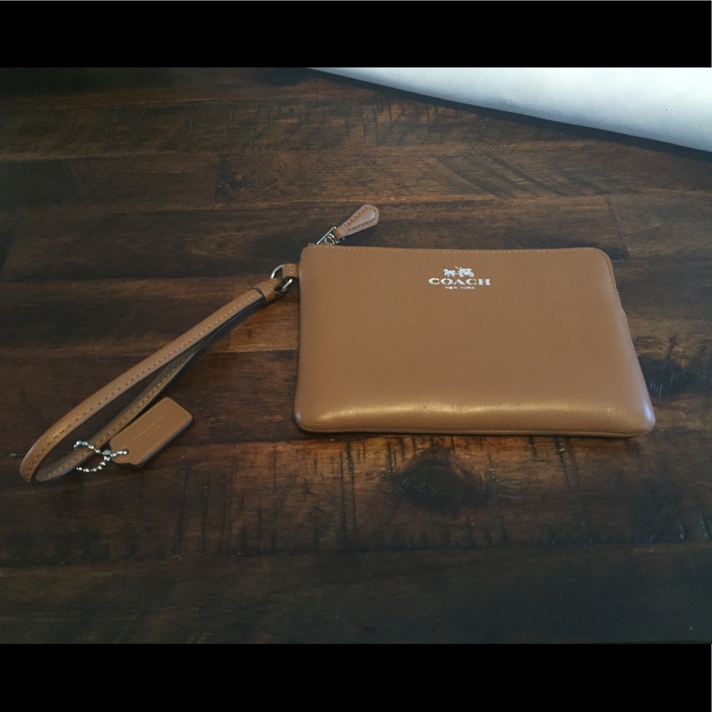 Coach Wristlet in the color Saddle